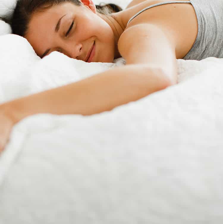 Close up of woman sleeping in bed, Hands holding end of unzipped mattress, Better Sleep Council